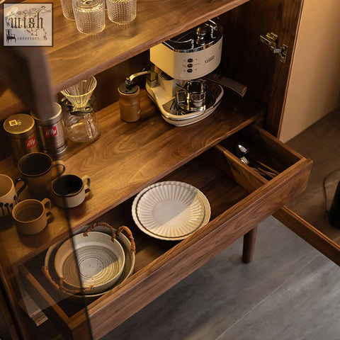Cream-colored ceramic plate with fluted edge on a solid wood anisimov cabinet wine storage with wine rack shelf