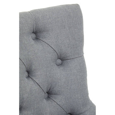 Gray tufted fabric headboard with spherical buttons and stitched lines on an anita grey fabric chrome base home chair