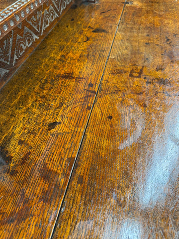 Antique carved oak hall table with rich amber finish and intricate detailing perfect as a hall table or sideboard