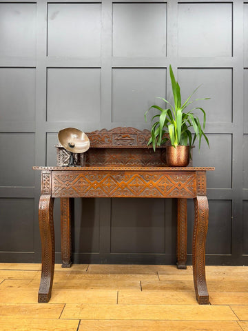 Antique anglo-indian carved oak hall table with intricate carvings and rich brown finish perfect as a hall table