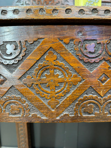 Antique carved oak hall table with intricate wooden carvings and warm aged finish perfect as a hall table or sideboard