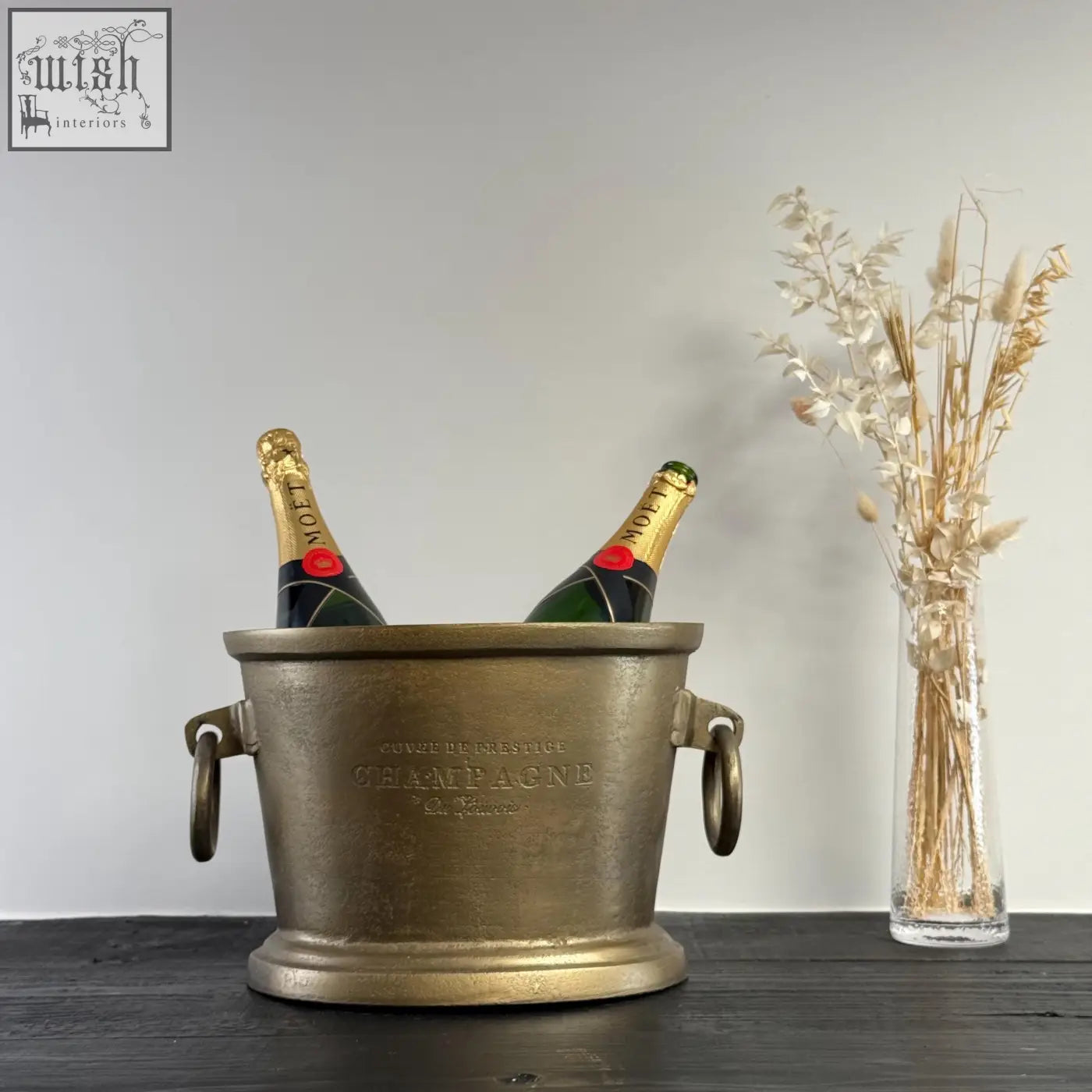 Antique brass solid cast engraved champagne ice bucket cooler with cuvée de prestige and two moët & chandon bottles, vintage french brasserie style