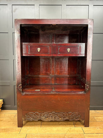 Dark reddish-brown wooden antique chinese wedding cabinet with two drawers and ornate carved base for display or bookcase