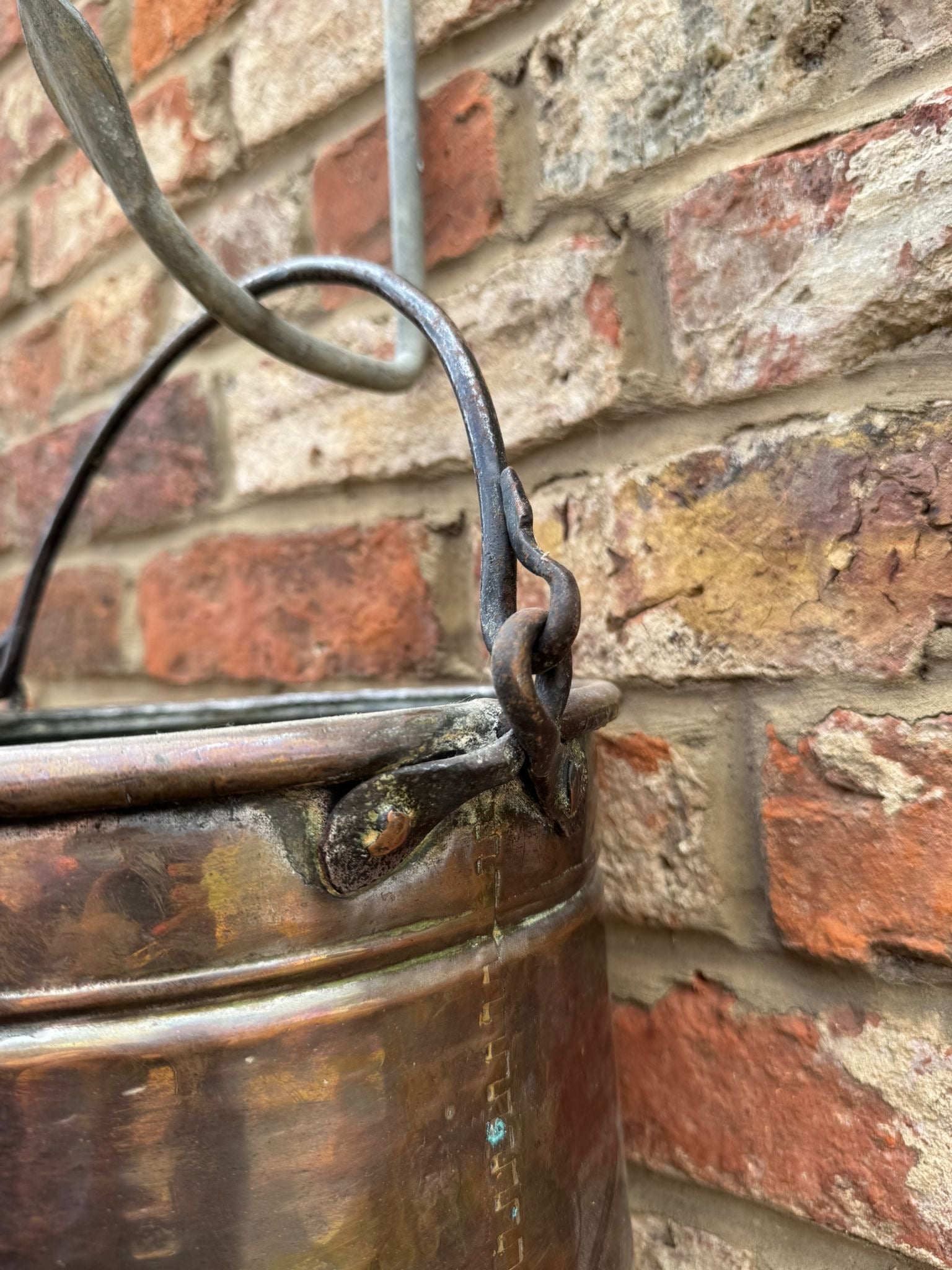 Antique copper cauldron pot with riveted iron handle and decorative copper finish perfect as a planter or decorative piece