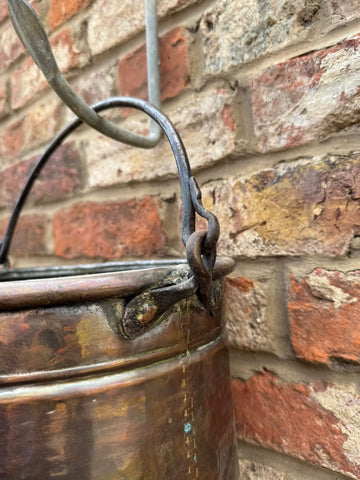 Antique copper cauldron pot with riveted iron handle and decorative copper finish perfect as a planter or decorative piece