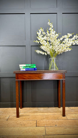 A polished mahogany tea table with a dark wood finish, single drawer, and slender legs perfect as an occasional side table