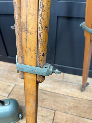 Vintage wooden cane with green metal clasp shown with antique hall brothers theodolite surveying instrument