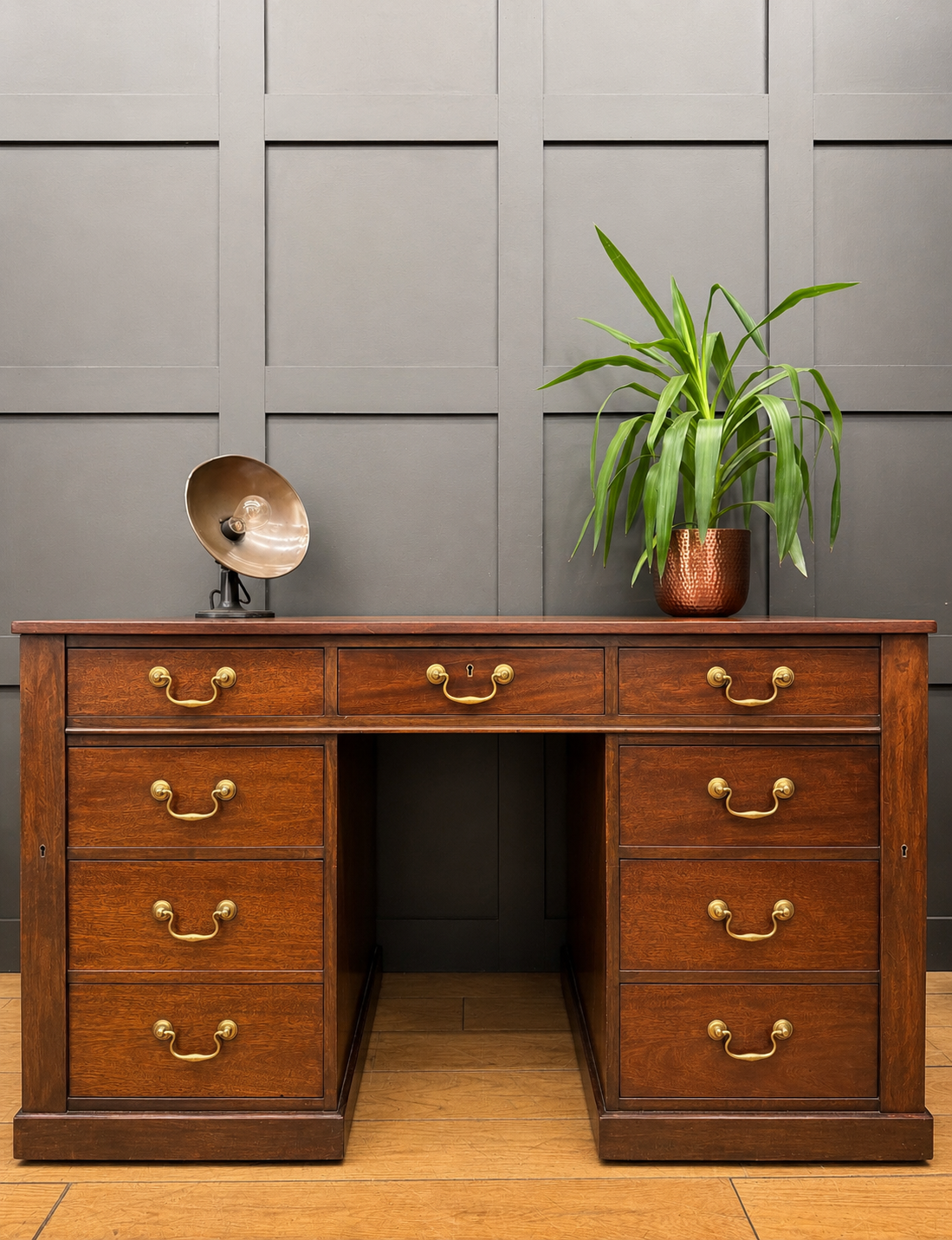Antique mahogany twin pedestal desk with rich wood finish brass handles and six drawers on each side with kneehole design