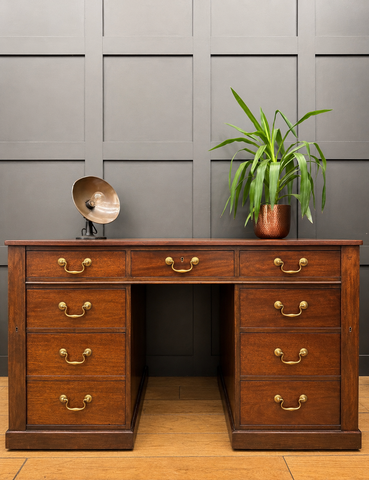 Antique mahogany twin pedestal desk with rich wood finish brass handles and six drawers on each side with kneehole design