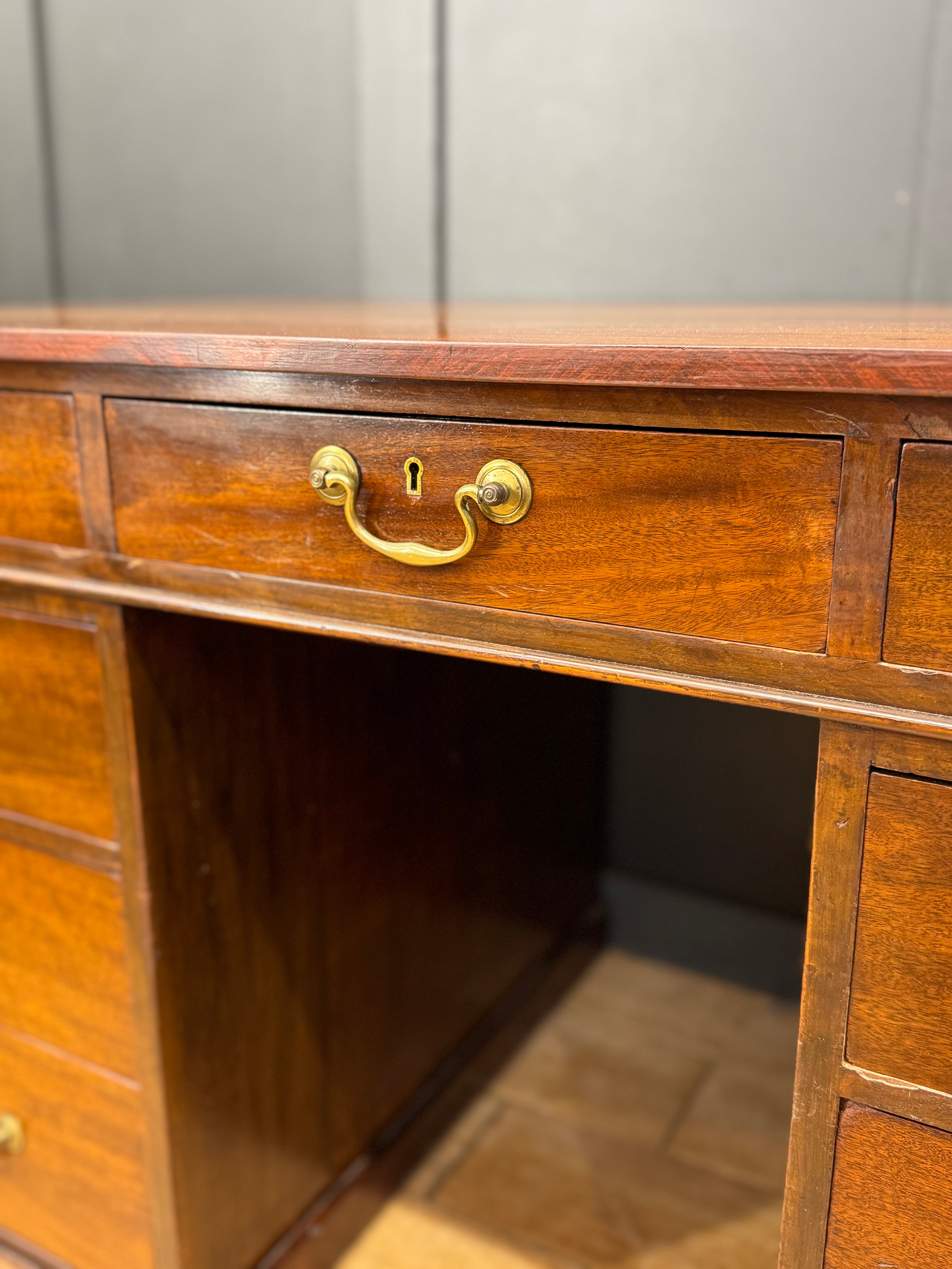 Antique mahogany twin pedestal desk with brass hardware and keyhole ideal for writing and office use