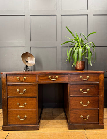 Antique mahogany twin pedestal desk with brass handles and polished wood finish perfect for writing or computer use