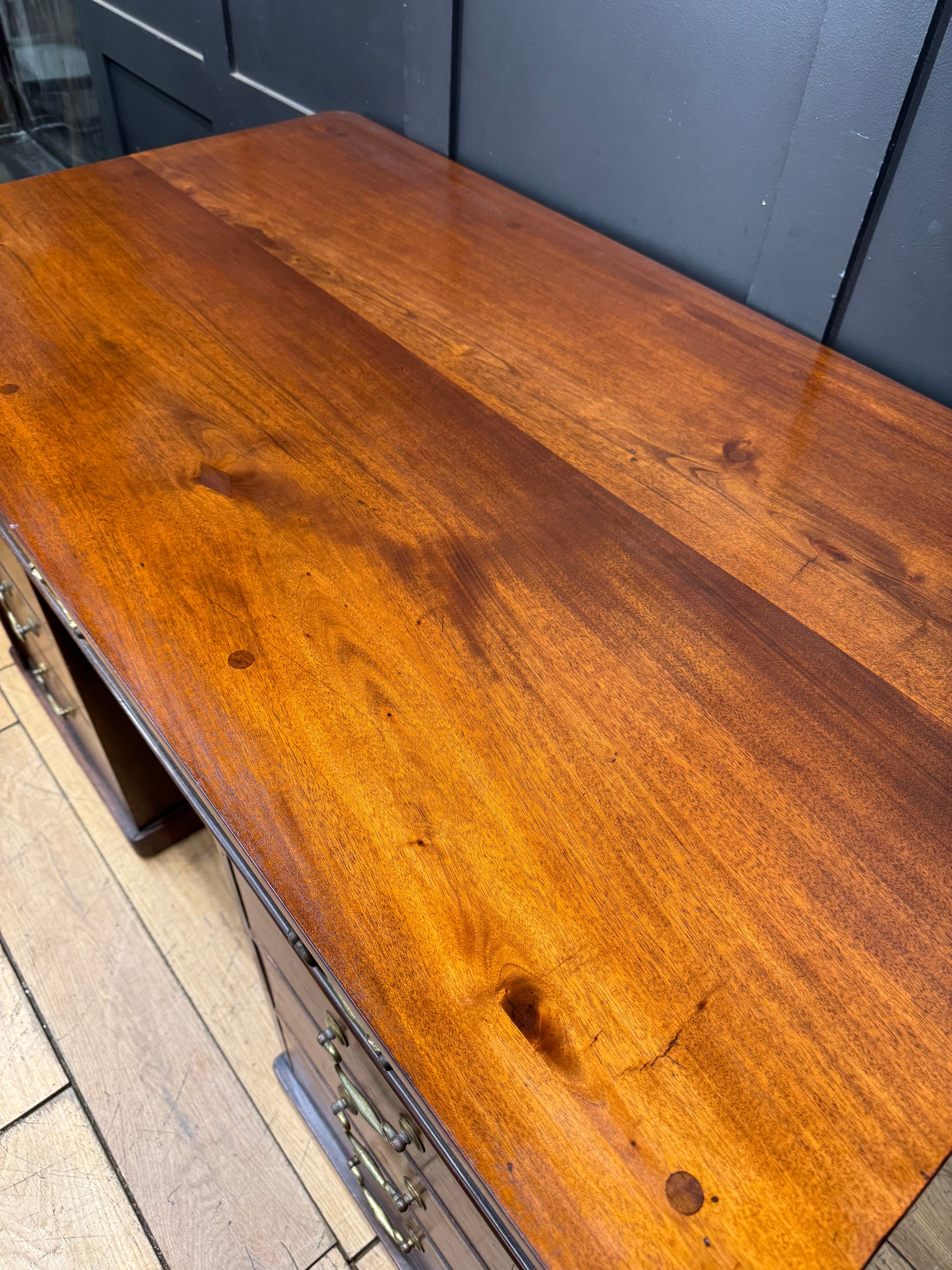 Antique mahogany twin pedestal kneehole writing desk with rich warm-toned wood and polished finish
