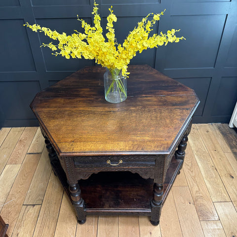 Antique oak credence table with dark oak hexagonal top carved legs and single drawer as sideboard lamp table