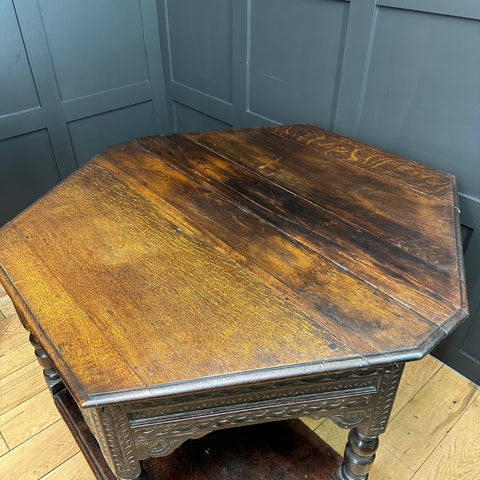 Antique oak credence table with octagonal shape dark brown finish and intricate carved legs perfect as a lamp table