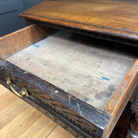 Antique oak credence table drawer with ornate carved edges and brass handle in hexagonal oak sideboard design