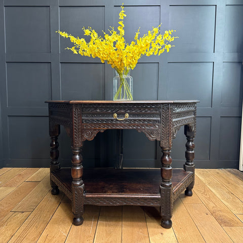 Antique oak credence table with hexagonal shape dark wood intricate carvings and brass handle drawer sideboard lamp table