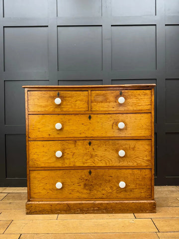 Antique pine chest of drawers with five oak drawers white ceramic knobs and black metal hardware for country house storage