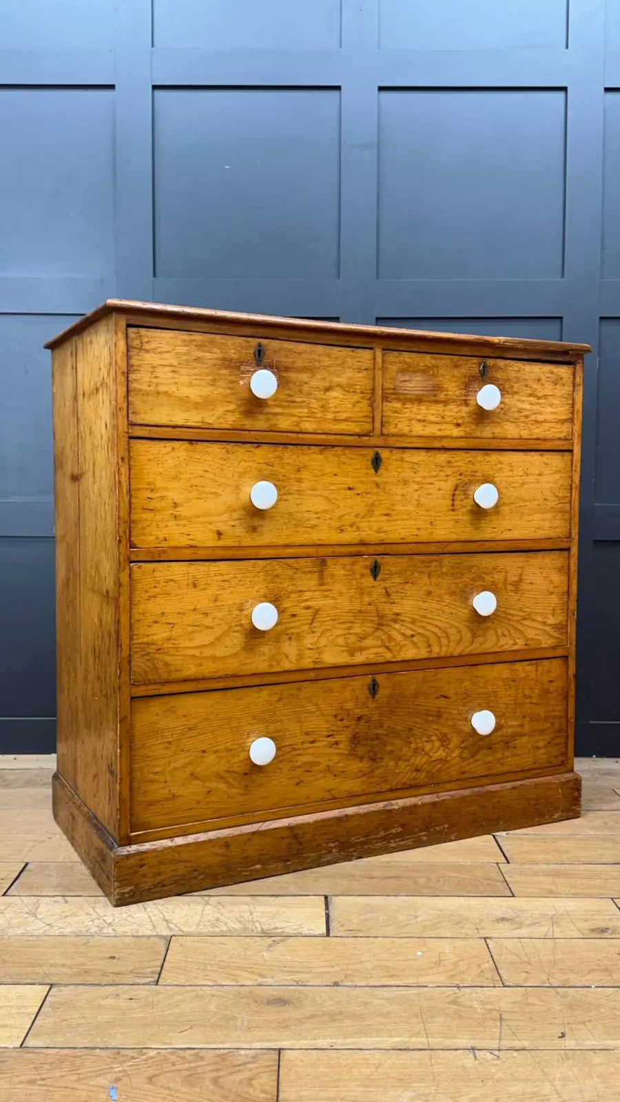 Antique oak chest of drawers with five ceramic knob drawers perfect for country house storage and pine chest decor
