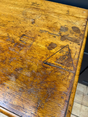 Worn yellow pine chest of drawers with scratches and faded logo perfect for a country house storage space
