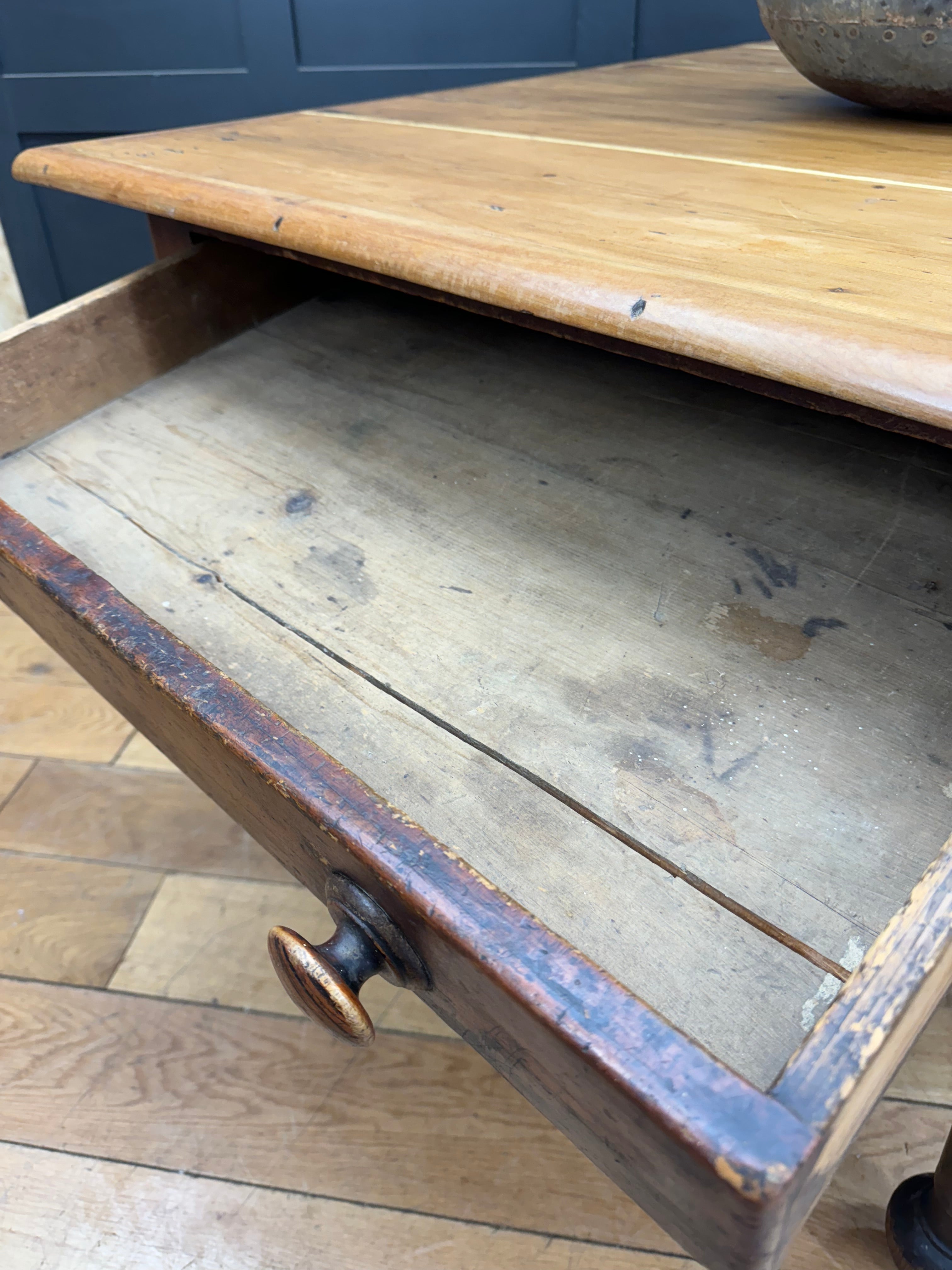Antique pine kitchen table with single drawer worn finish and dark brass knob perfect for rustic farmhouse decor