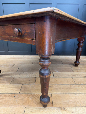 Antique dark wood pine kitchen table with single drawer and turned legs perfect for rustic farmhouse decor