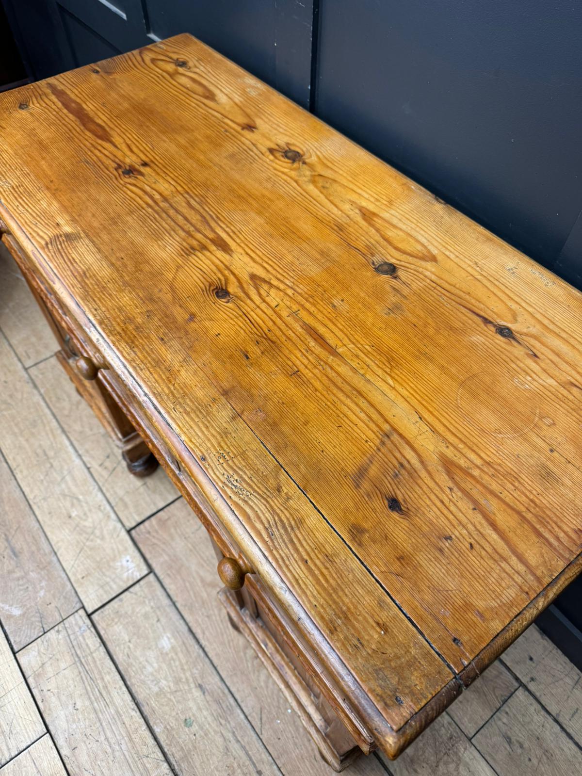 Antique pine pedestal desk dressing table with cupboards and drawers in warm golden brown pine with carved legs