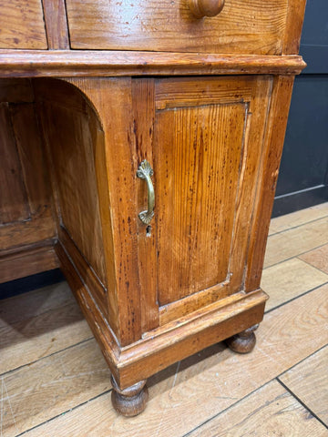 Antique pine pedestal desk with warm amber finish brass handle and turned wood legs for dressing table use