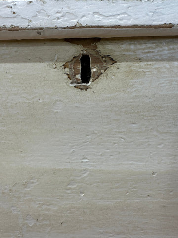 A weathered off-white painted pine trunk with a dark worn keyhole perfect as an antique blanket box or sideboard