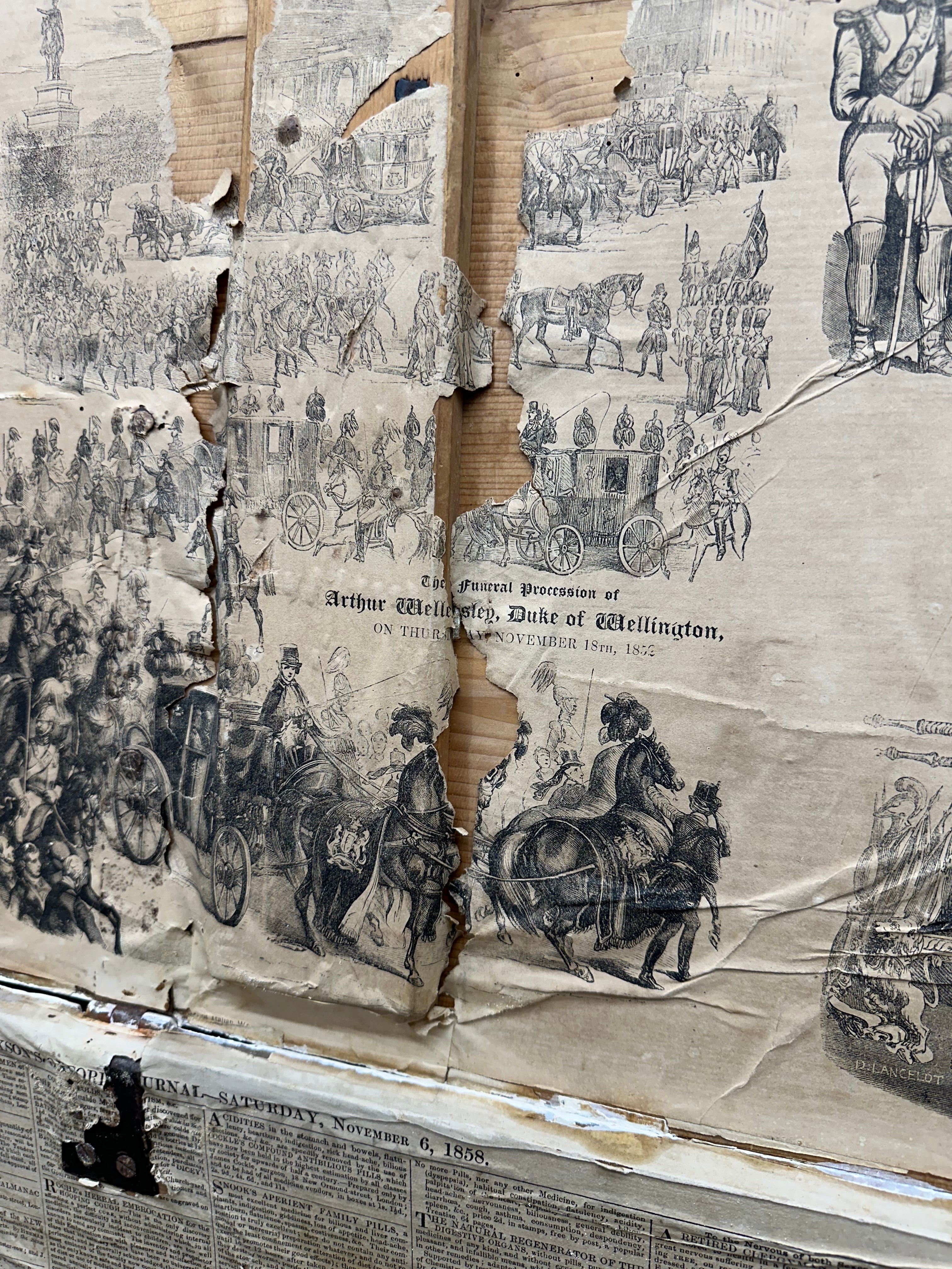 Torn sepia pine trunk showing the funeral procession of arthur wellesley duke of wellington on an antique blanket box