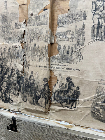 Torn sepia pine trunk showing the funeral procession of arthur wellesley duke of wellington on an antique blanket box