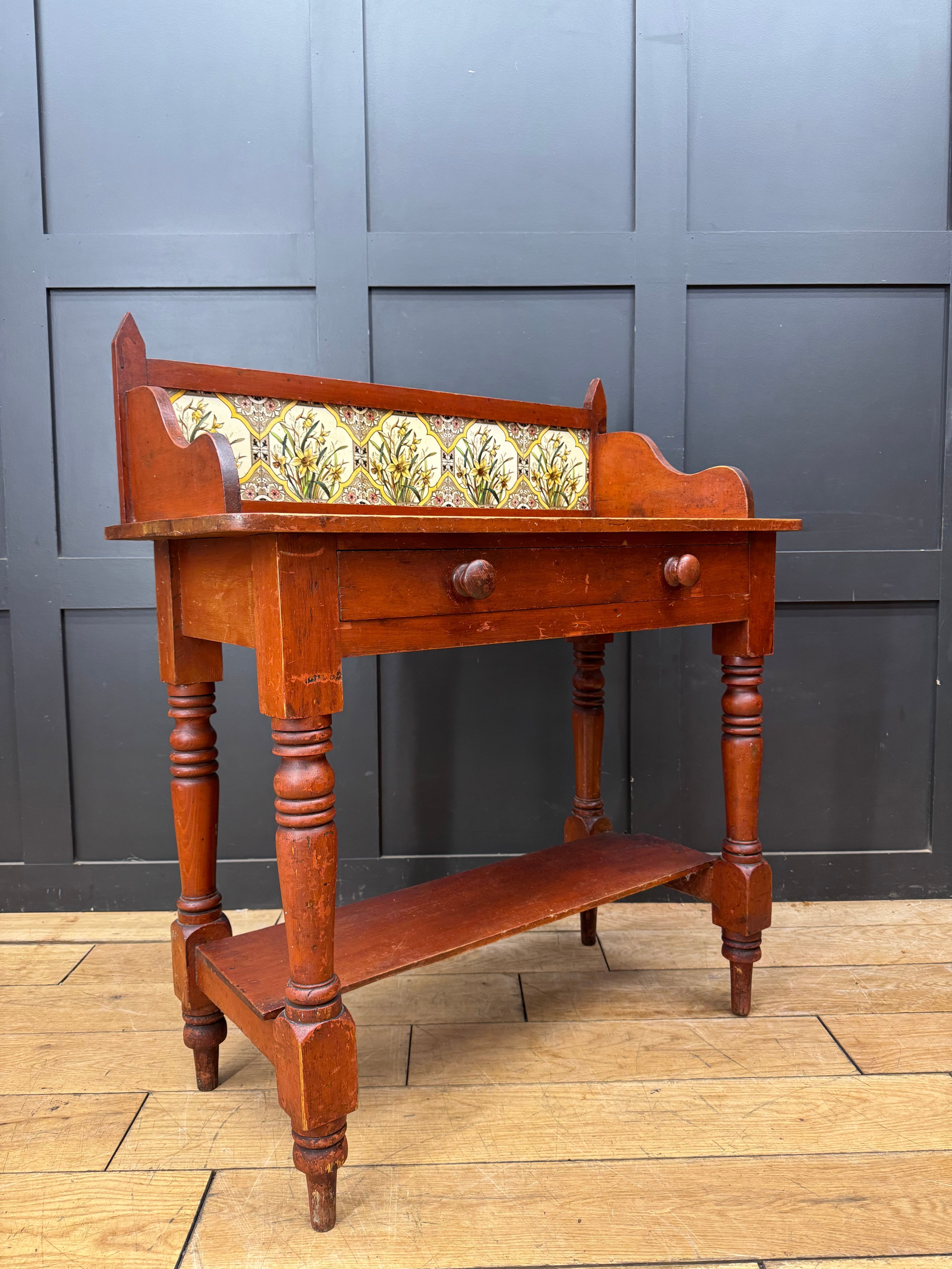 Antique pine washstand wooden desk with decorative tiled back panel turned legs and wooden knobs late victorian style