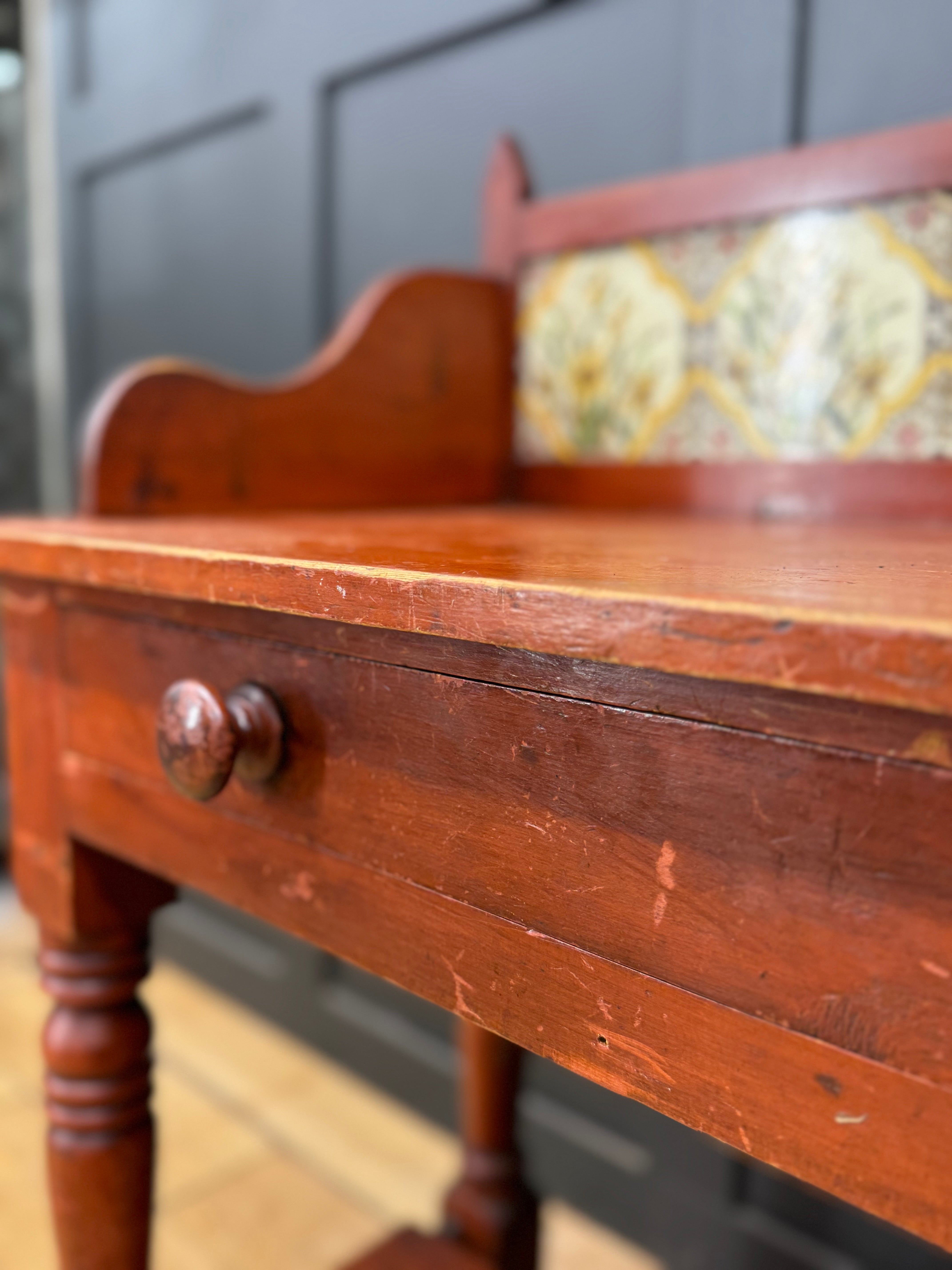 Antique late victorian pine washstand side table in reddish brown wood with decorative floral tile and wooden knobs