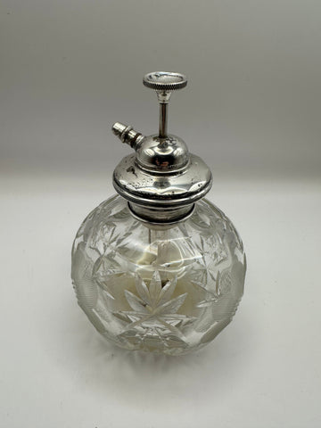 Clear crystal cut glass perfume bottle with starburst etching and polished silver metal spray nozzle for dressing table use