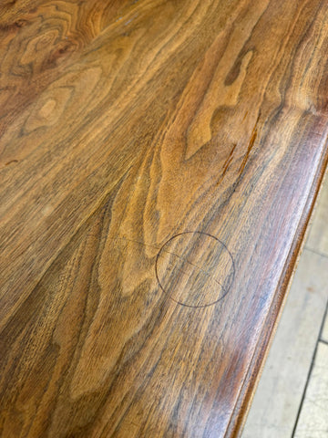 Polished solid walnut surface of an antique chest showing rich grain and a circular mark for bedroom storage furniture