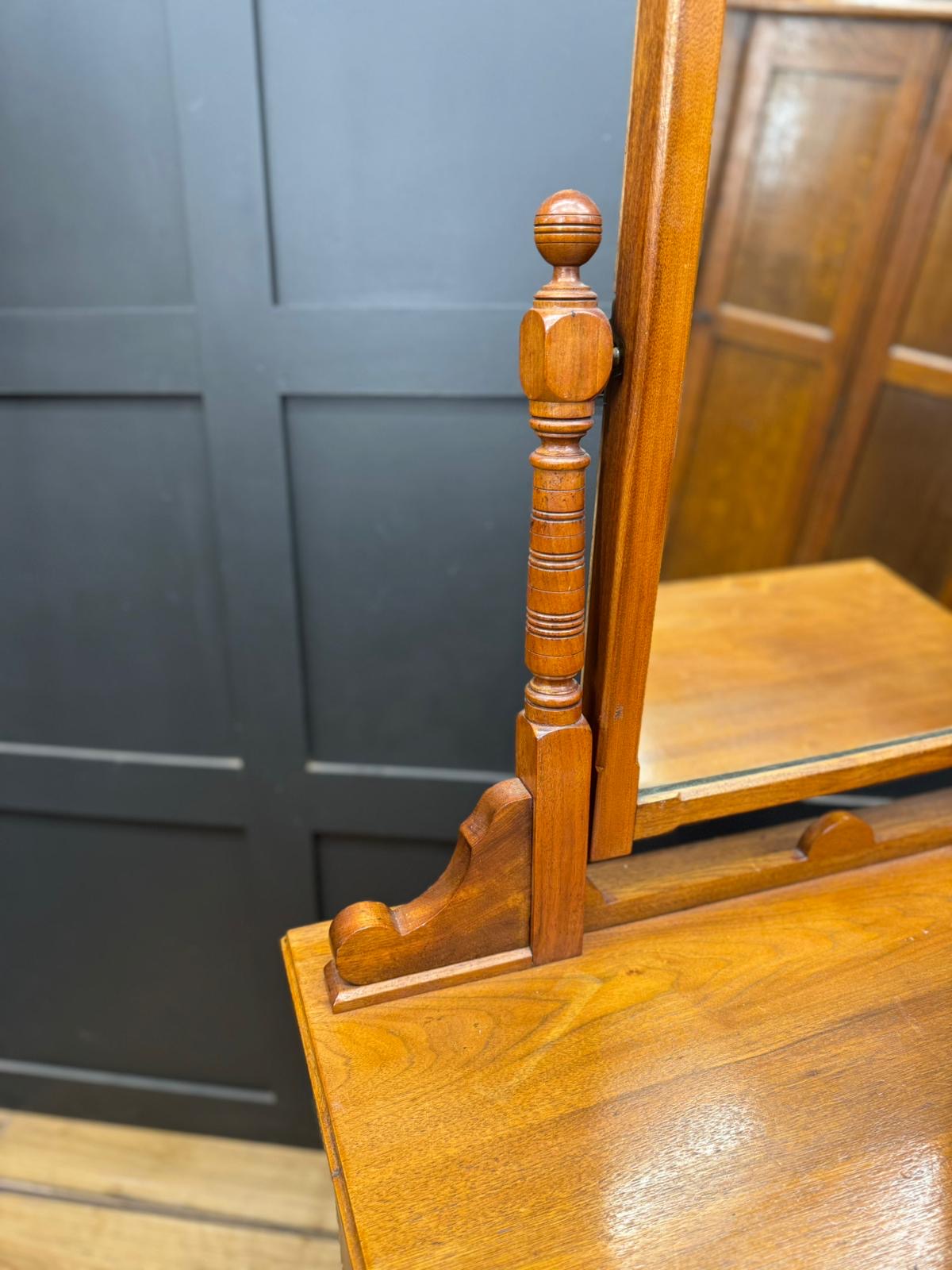 Antique walnut chest of drawers by maple & co with polished amber mirror and ornate carved vertical support drawer fronts