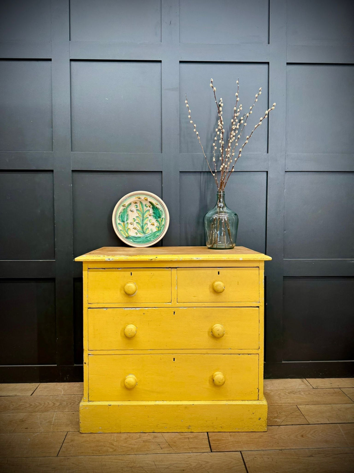 Bright yellow pine chest of drawers with four knobs and natural wood top perfect for farmhouse bedroom storage