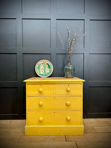 Bright yellow pine chest of drawers with four knobs and natural wood top perfect for farmhouse bedroom storage
