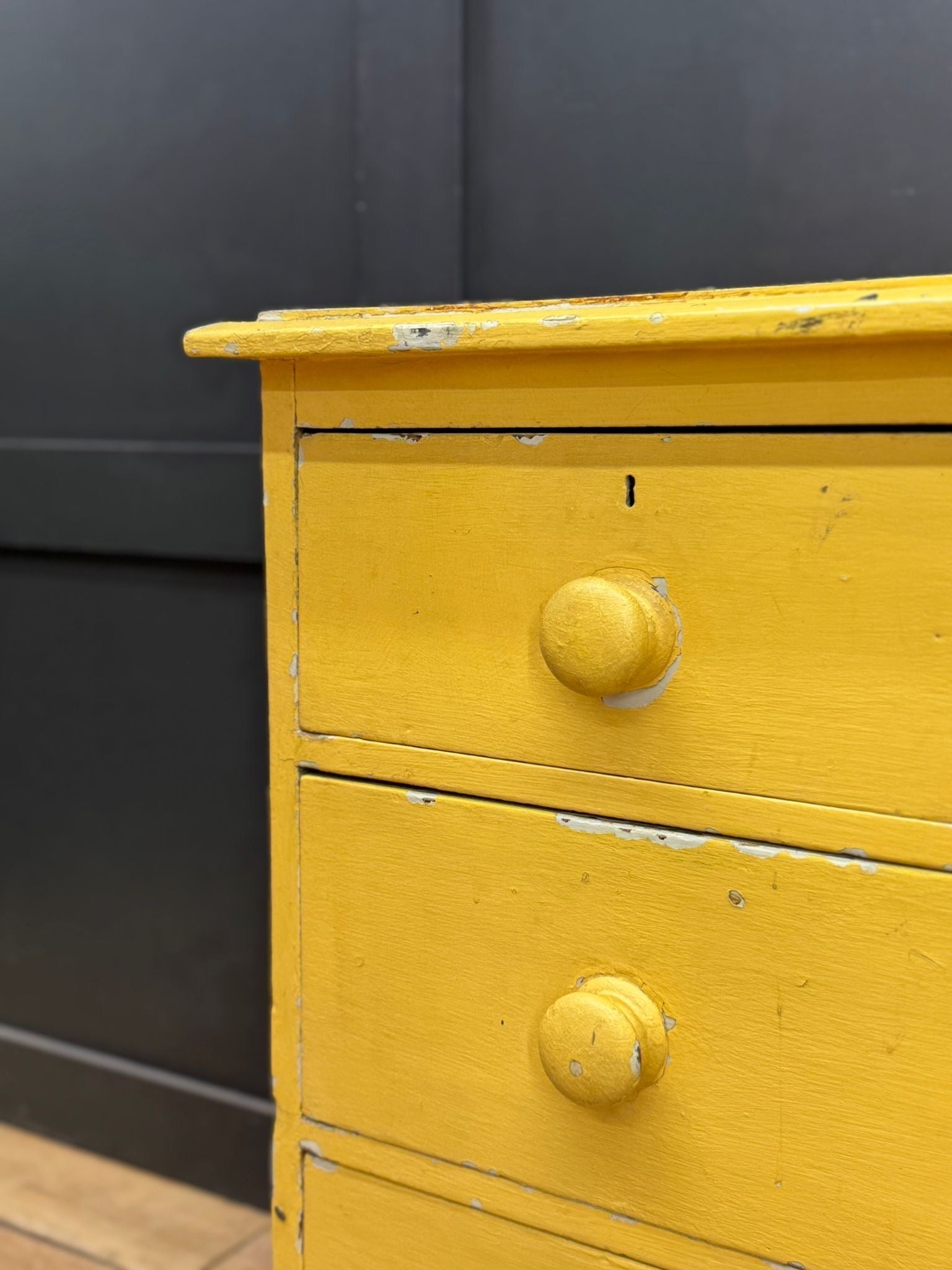 Vintage yellow pine chest of drawers with two knobs and chipped paint perfect for farmhouse bedroom storage
