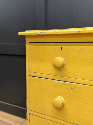 Vintage yellow pine chest of drawers with two knobs and chipped paint perfect for farmhouse bedroom storage