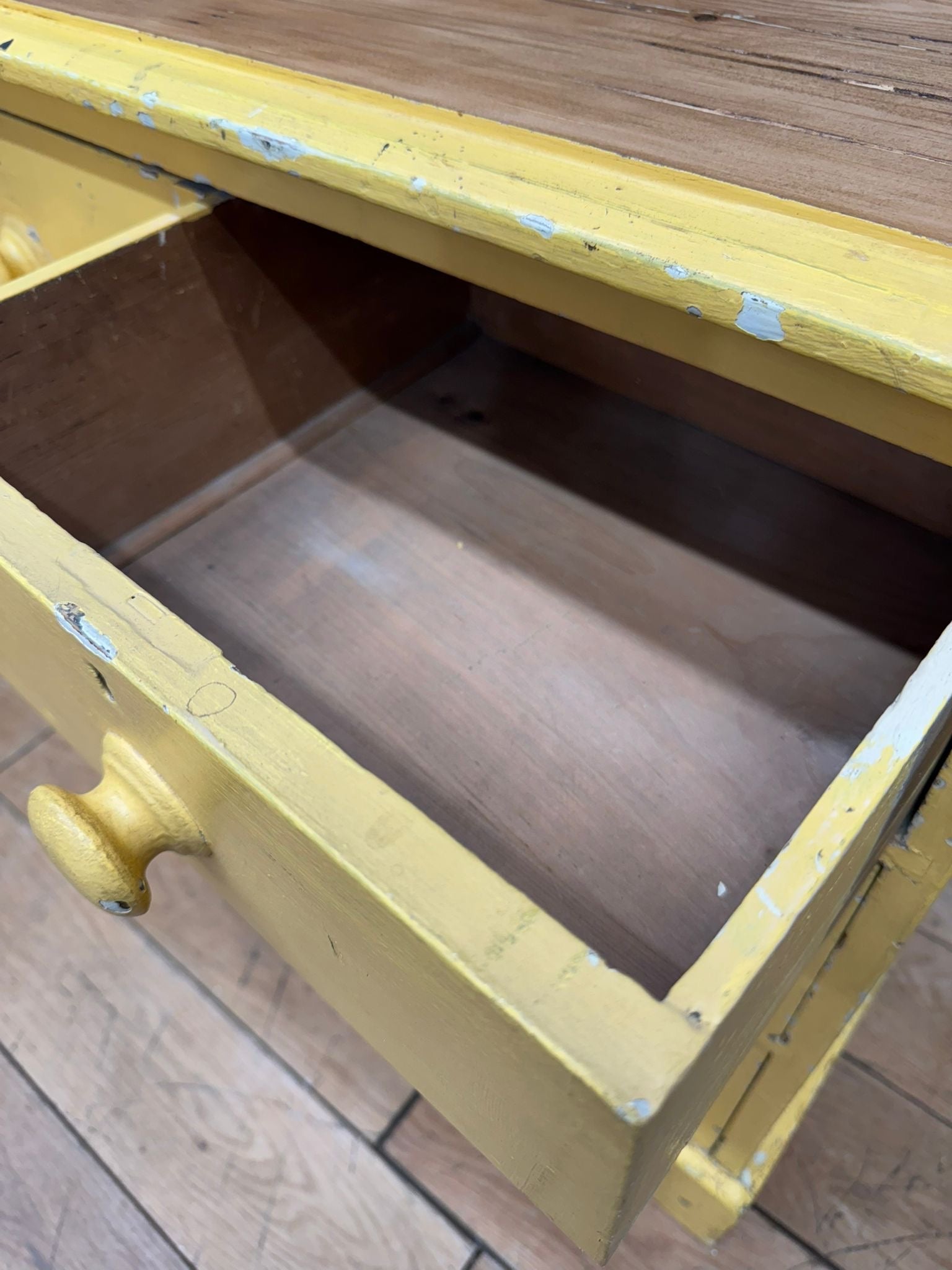 Yellow painted pine chest drawer with chipped paint and round knob perfect for farmhouse bedroom storage