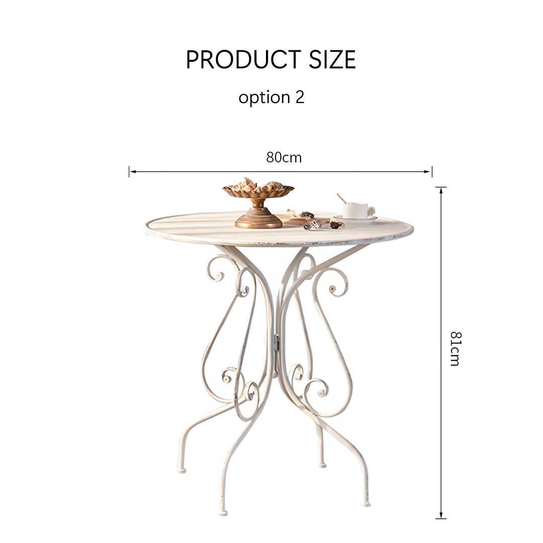 White wrought iron antonia outdoor garden dining table with ornate scrollwork legs and distressed finish