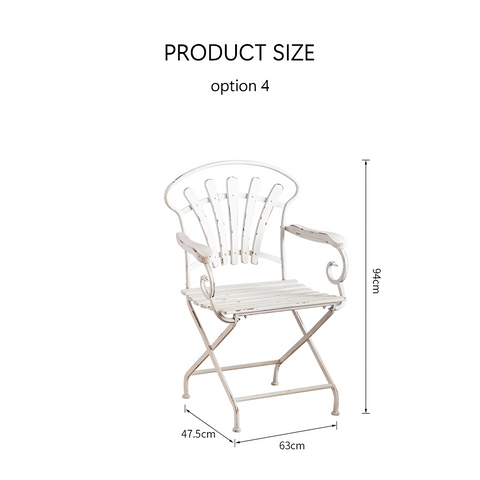 White distressed metal folding chair with ornate scroll arms and fan shaped backrest in antonia outdoor garden set
