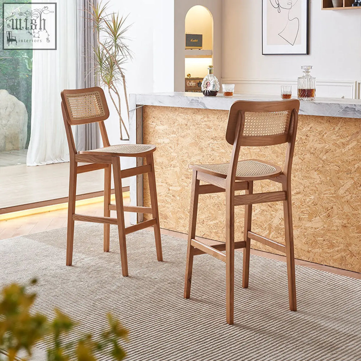 Two anya bar stools with woven rattan seats and solid wood natural finish perfect for home bars