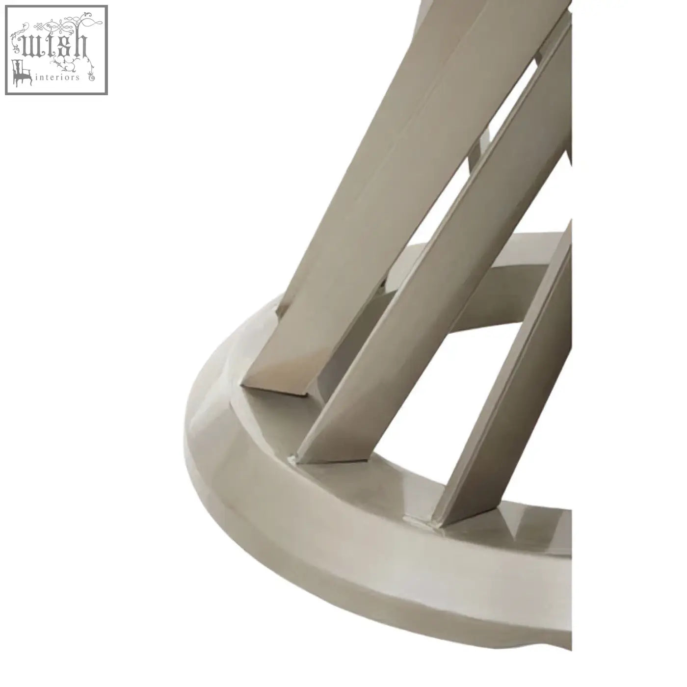 Close-up of the anzio clear glass dining table base with a sleek white hourglass base and curved legs in matte finish