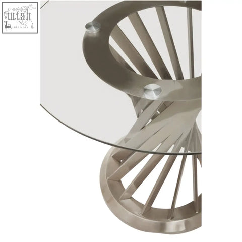 Modern dining table with anzio clear glass top and silver hourglass base in brushed stainless steel