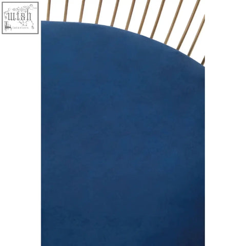 A solid deep navy blue velvet circular mat with a smooth surface and slightly curved edge for anzio brushed gold chair