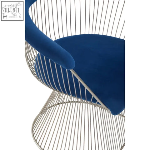 Blue velvet cushioned anzio navy blue chair with brushed silver curved wireframe base and armrests
