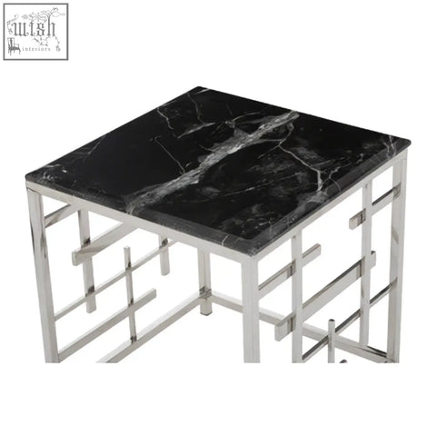 Aprilia black marble side table with sleek geometric chrome frame and black marble top for stylish living spaces