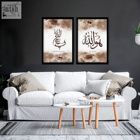 White upholstered sofa with beige and white throw pillows and arabic calligraphy wall art prints on the wall
