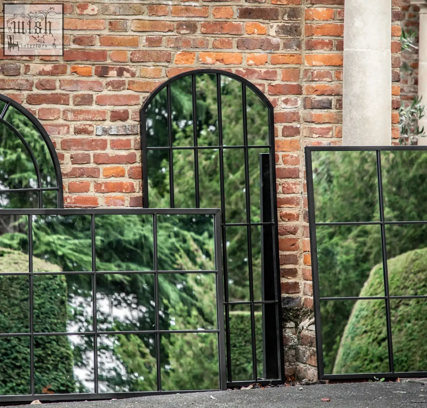 Black wrought iron arched and rectangular outdoor metal black mirror with window pane design grid patterns